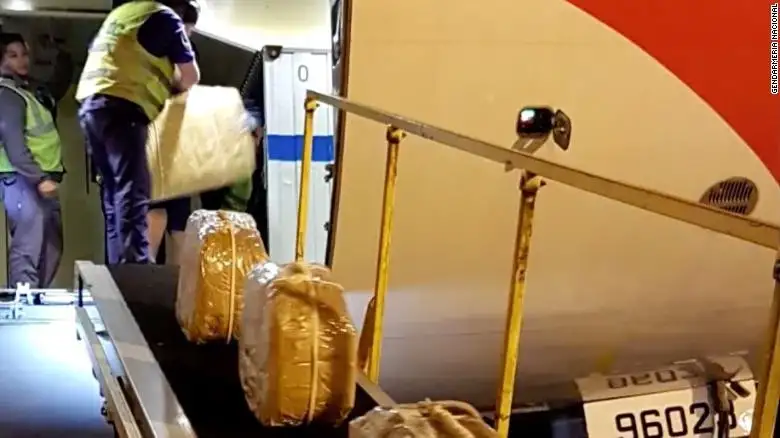 Sealed suitcases on an airplane ramp