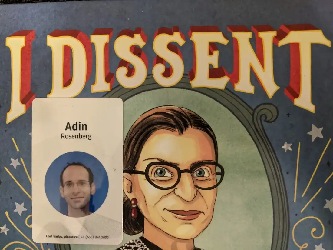 Adin's badge on top of the cover of the 'I Dissent' children's book about Ruth Baden Ginsburg