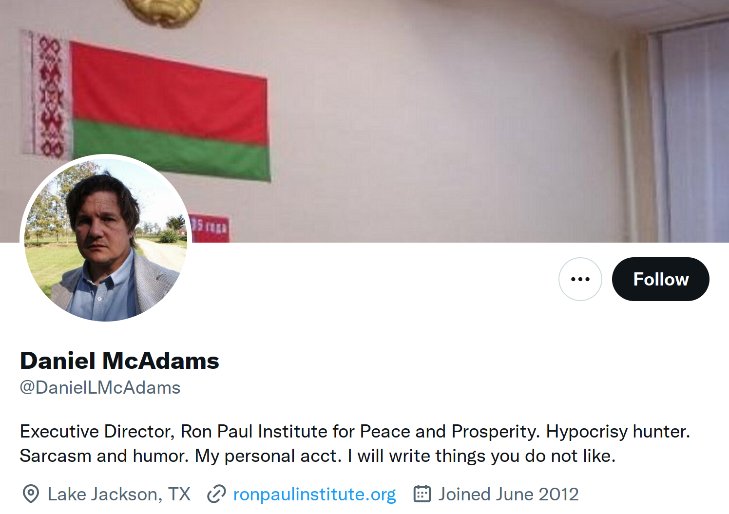 Twitter profile background features the Lukashenka flag of Belarus